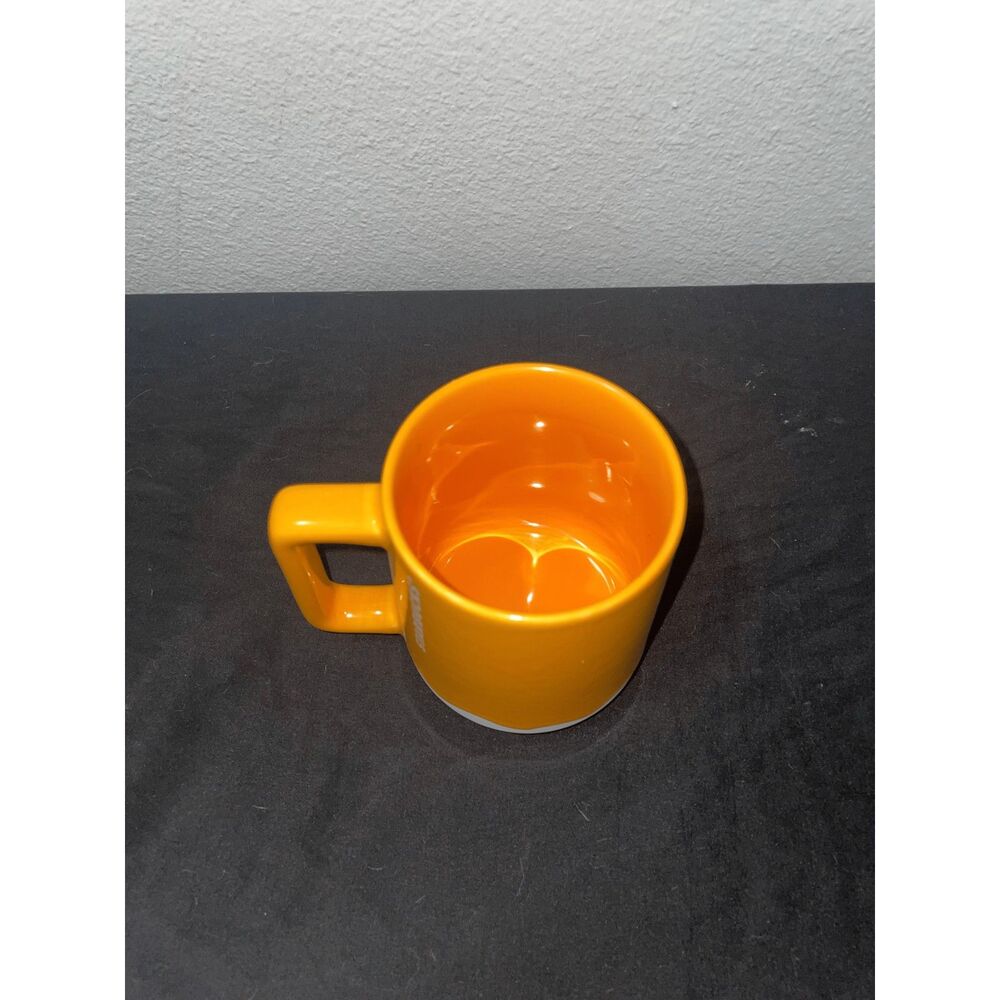 Starbucks 2023 Orange Ceramic Coffee Mug 14 oz White Wavy Base
